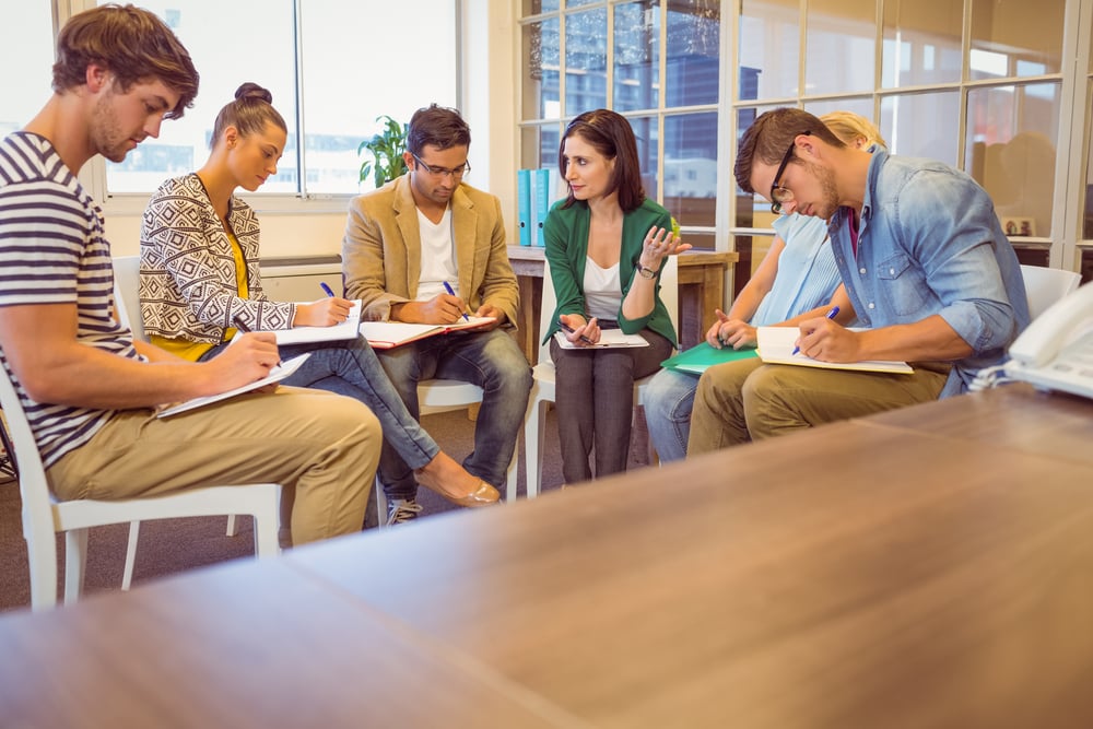 Attentive creative business team in meeting at office